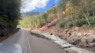 Roads crumbled, debris in rivers and vehicles navigate damaged roads in North Carolina