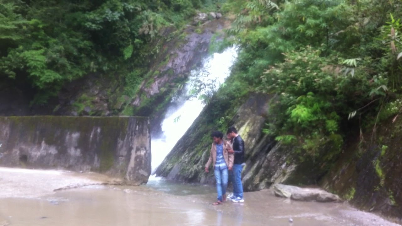 Water Falling and Flowing Over The Road.