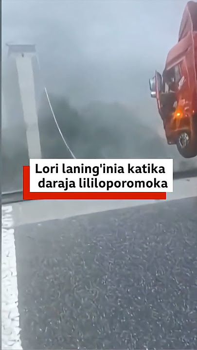 Lori laning'inia kwenye ukingo wa daraja lililoporomoka