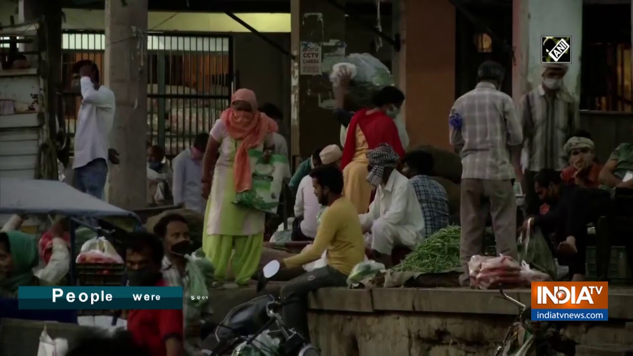 COVID-19: People make purchases at Delhi`s Okhla vegetable market