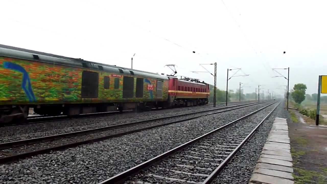Trains and Rains Ex WAP-6 accelerates with Pune-Howrah LHB Duronto!
