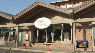 Topeka police investigating vehicle crashing into residence and business