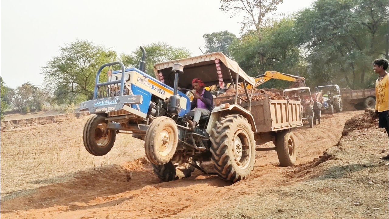 swaraj tractor stuck in mud and pulling out by jcb tractor videos