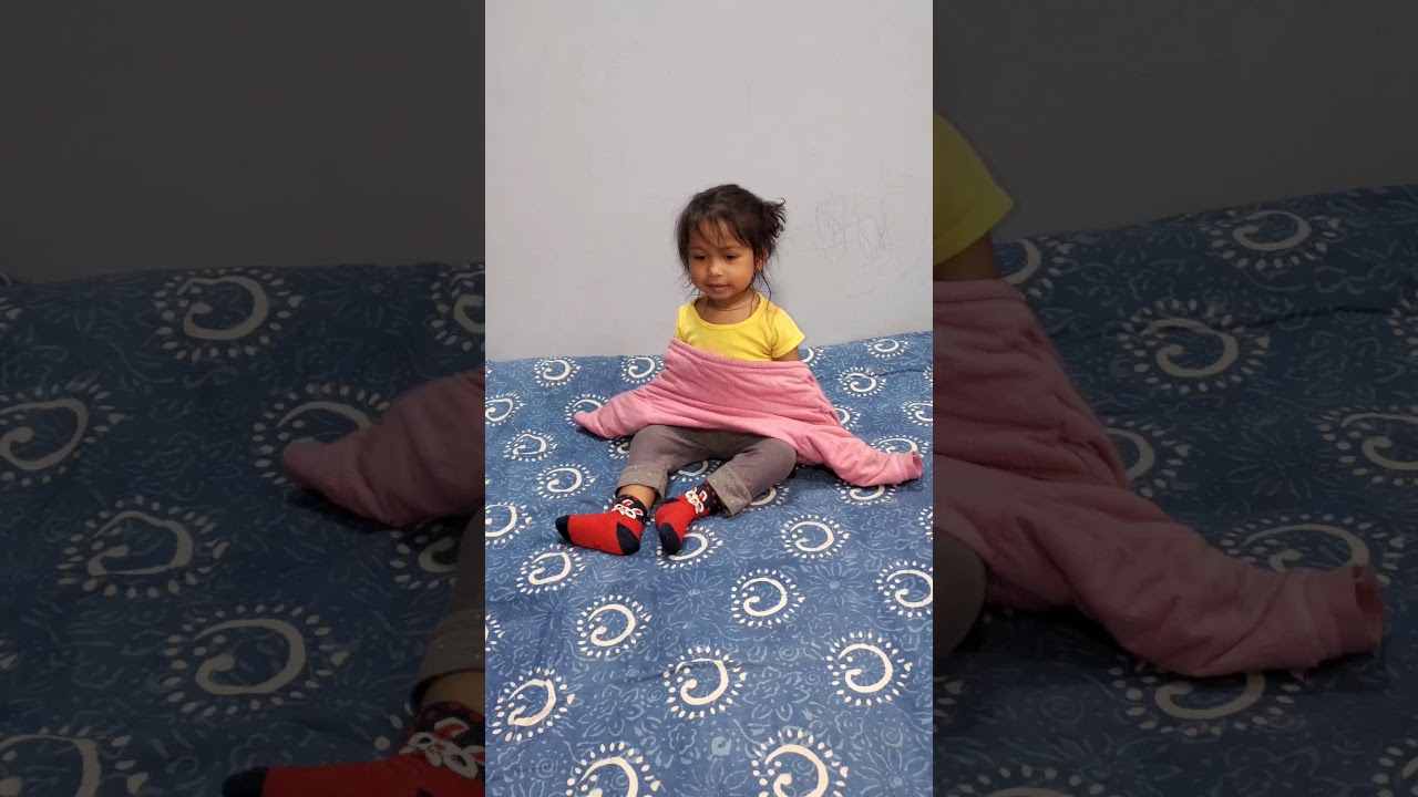 2 year old toddler shows the Montessori Coat Flip in 3 attempts