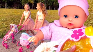 Baby Annabell doll and baby doll go for a walk. Video for kids