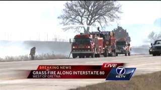 Multiple departments battle grass fire along I-80 near Gretna