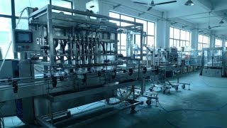 The installation& Disassembly of four heads liquid filling machine by engineer آلة ملء السائل