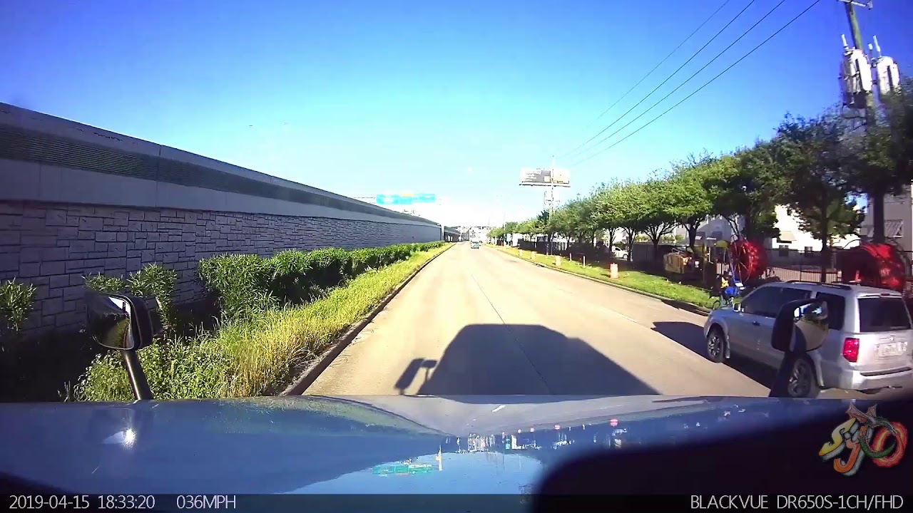 Cyclist going the wrong way and an asshole in an SUV - YouTube