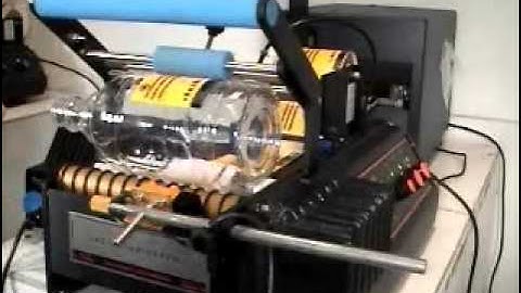 Labeling machine - Front and back labels on plastic wine bottle  - BenchMAX with Orientation