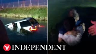 Police rescue driver from sinking car after crashing into pond