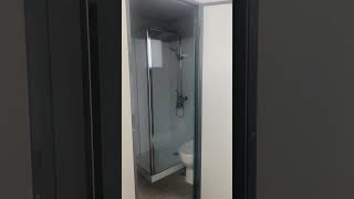 Portable bathroom unit with laundry shower toilet