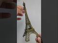 Elegant Eiffel Tower decorative piece. Crafted with intricate detailing and a metallic finish.