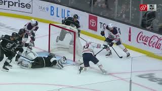 Jonathan Quick reaches behind and makes a diving save on Ryan Nugent-Hopkins.