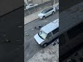 Angry woman throws clothes out of apartment window