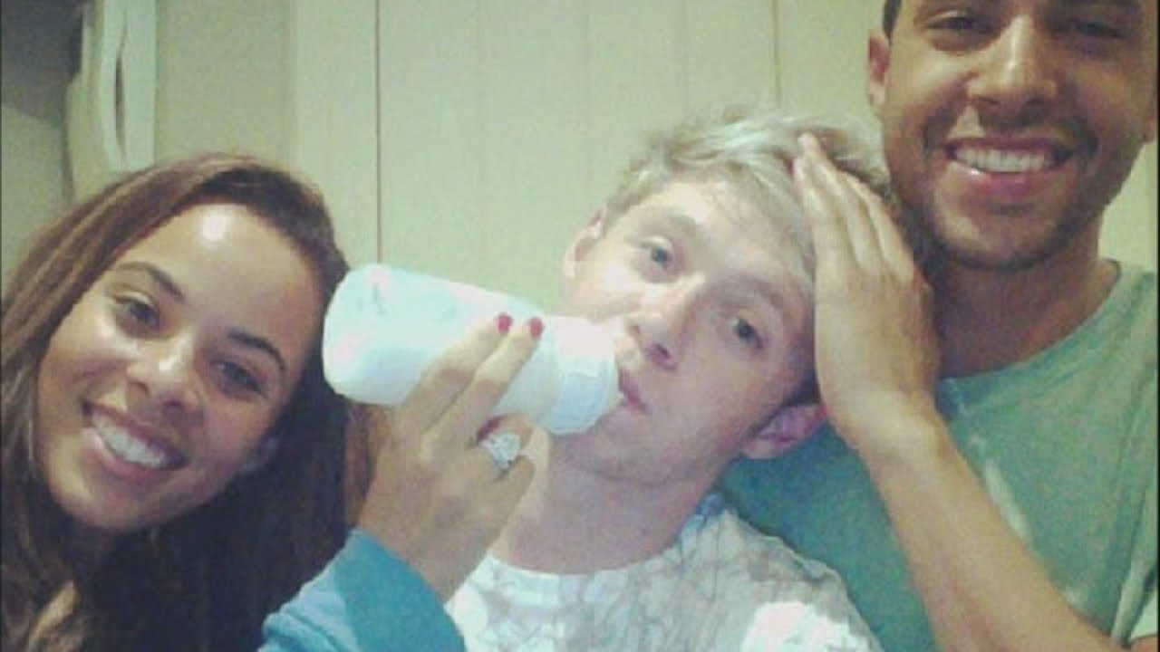 Very an adult drinking from a baby bottle all An adult drinking from a baby bottle