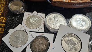 monede diferite din argint pentru coletie .