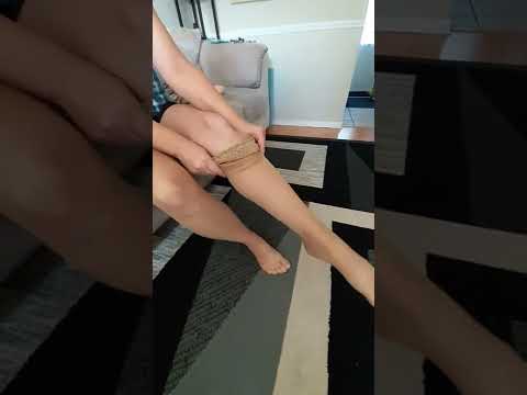 putting on thigh highs. sexy new pack pull em up, slow and stop.