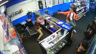 VIDEO: Gun battle breaks out between store employee and would-be robbers screenshot 5