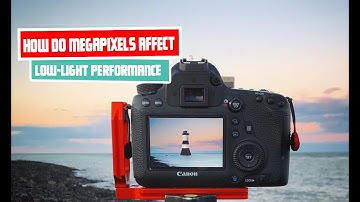 How do megapixels affect low-light performance and noise levels in photographs?