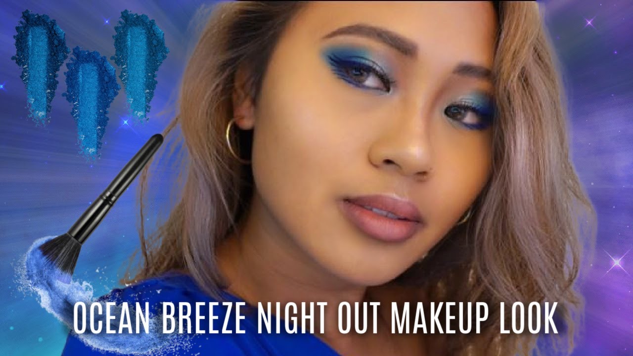 3. Blue Hair and Bold Winged Liner Makeup Look - wide 3