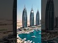 A futuristic marina surrounded by crown-shaped skyscrapers #construction #skyscraperconstruction #