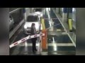 gangsta woman destroys parking gate barrier