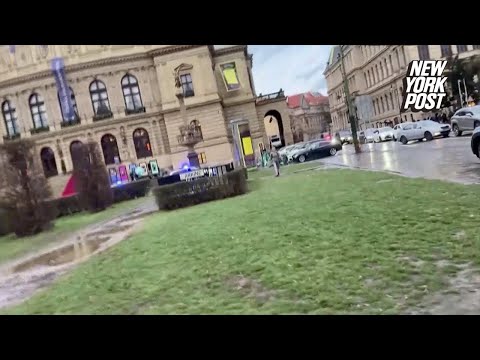 Panicked students seen huddling on ledge as at least 15 killed in shooting at university in Prague
