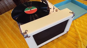 AudioTronics record player playing an LP record.  Circa 1963 300A