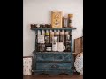 Arranging Spices On A Wooden Rack With Drawers