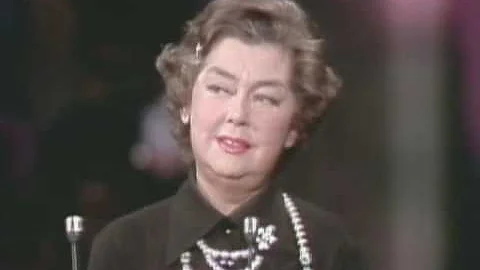 Rosalind Russell receiving a special Oscar statuette