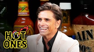 John Stamos Falls Out of His Chair While Eating Spicy Wings | Hot Ones