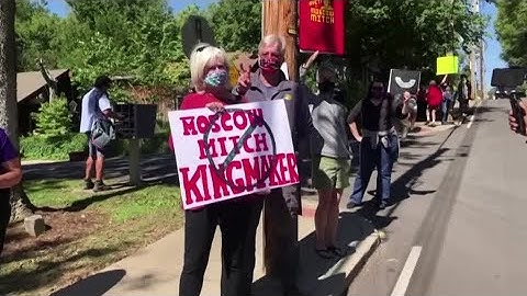 Protesters gather outside Mitch McConnell’s home