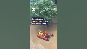 Man hangs onto tree during Vietnam floods