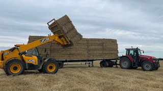 Rush to beat the rain ,collecting carting square bales of straw 2023