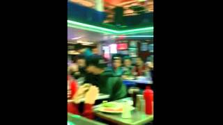 Waitress at Ellen's Stardust Diner singing "I Knew You Were Trouble" by Taylor Swift