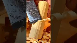 shaving wooden block with sharp metal tool for making craft project and creating smooth wood surface