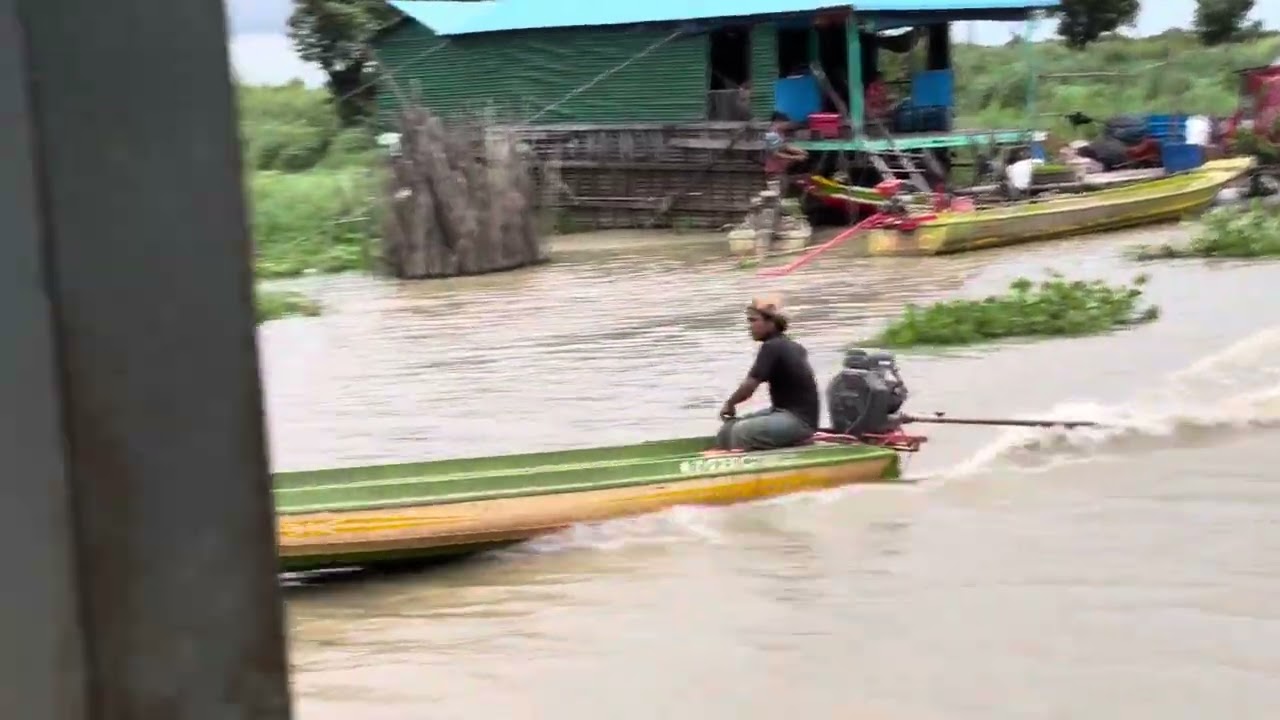 They are rowing a boat to tie the rope.