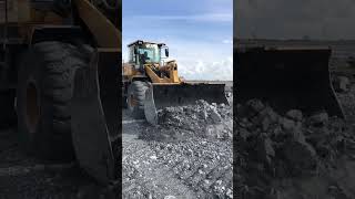 Heavy Machinery at Work: Loader Demolishes Gravel Mountain
