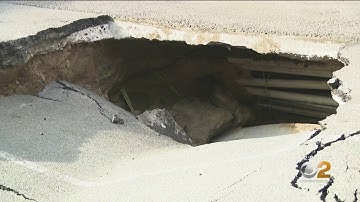 Sinkhole Opens In Brooklyn Street, Car Tumbles In