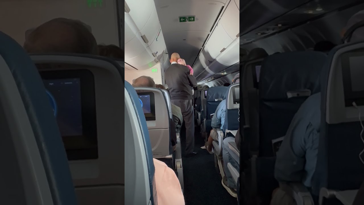 Flight Attendant Rocks Passenger S Baby Mid ViralHog