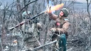 Russian sappers use a grenade launcher to mine the area with POM-2 mines