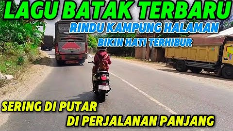 Lagu batak terbaru paling banyak dicari sering di putar Di perjalanan panjang rindu kampung halaman