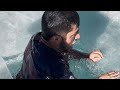 Man swim in extreme cold water  wooglobe