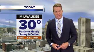 Partly to mostly cloudy Friday, colder