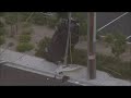 Car Runs Up Pole