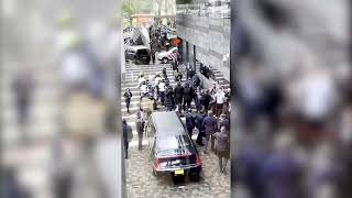 Police tackle protester running toward French president