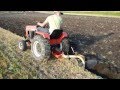 Case 448 Garden Tractor pulling a 10" Brinly Moldboard plow.