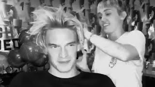 Miley Cyrus cutting Cody Simpson hair