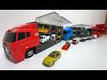 We will be putting 46 mini cars (Tomica) into 4 convoy trucks!