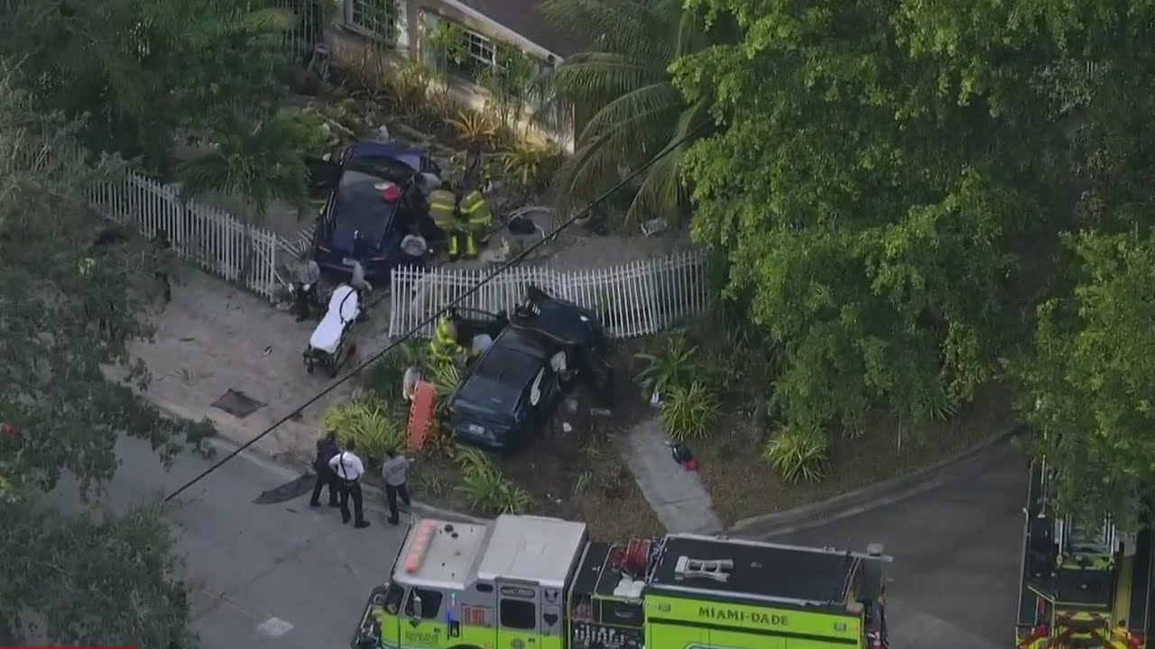 Four hospitalized after two‑car crash sends vehicles into North Miami yard